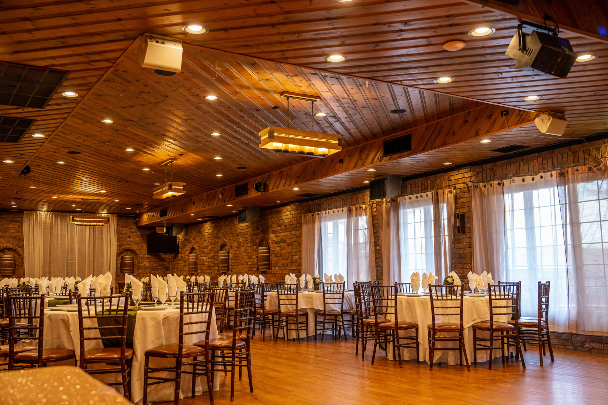 The Red Barrel banquet hall set with round tables